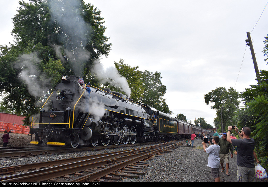  At last, the 2102 is attached to its train and this view is on the west side of the tracks